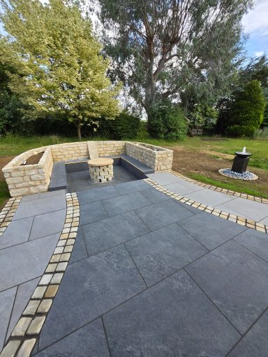 A sunken seating area featuring a firepit