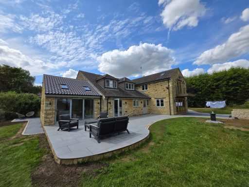 A porcelain patio with modern garden furniture